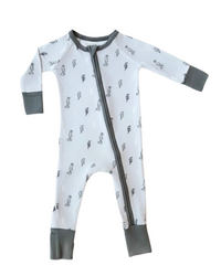 A baby long-sleeve footless sleeper with a front zipper, featuring a white body with a small black dinosaur print, gray cuffs, and a gray zipper.