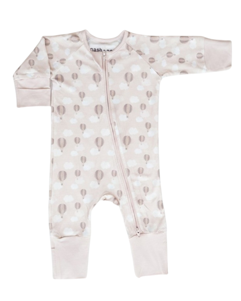 A baby long-sleeve footless zip-up sleeper in a pale pink color, featuring a pattern of small brown and white clouds and hot air balloons, shown against a plain white background.